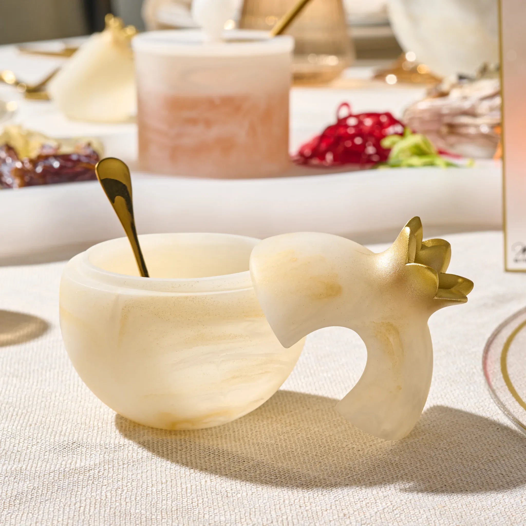 Gold pomegranate honey dish in marbled resin for Rosh Hashana table decor