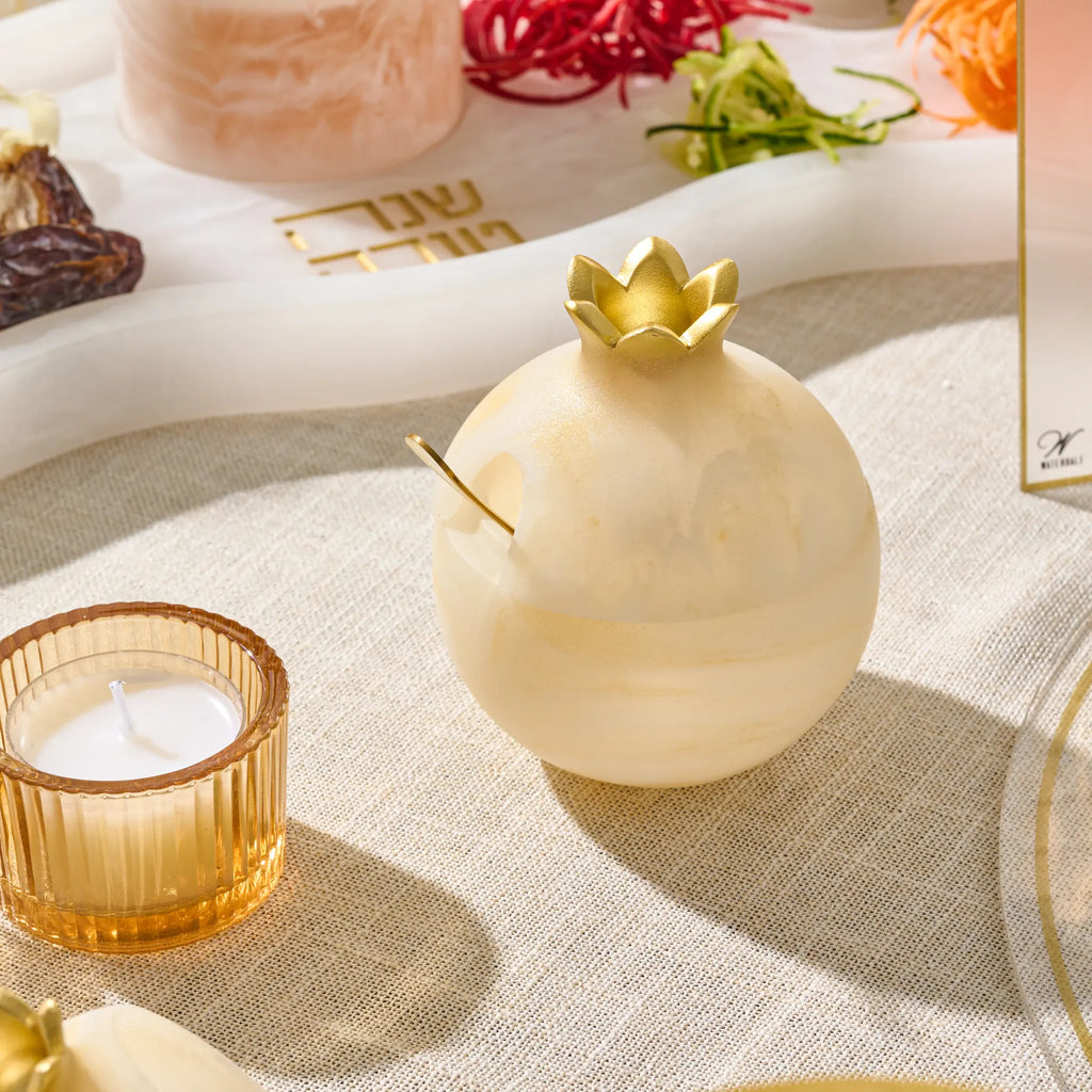 Gold resin pomegranate honey dish with its matching honey spoon, a Shana Tova gift