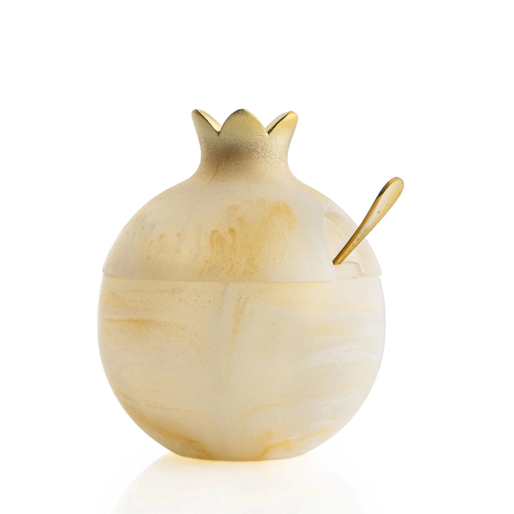 Gold resin pomegranate honey dish on a Rosh Hashonah table (ראש השנה)