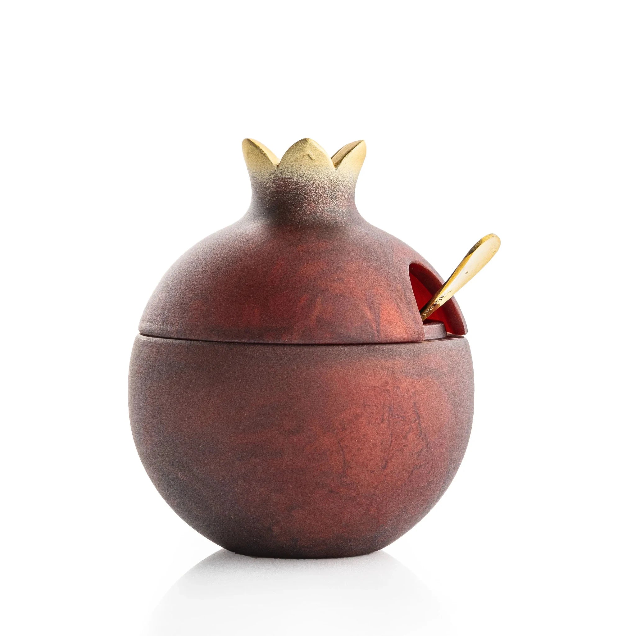 Deep red resin pomegranate honey dish for a Jewish New Year table