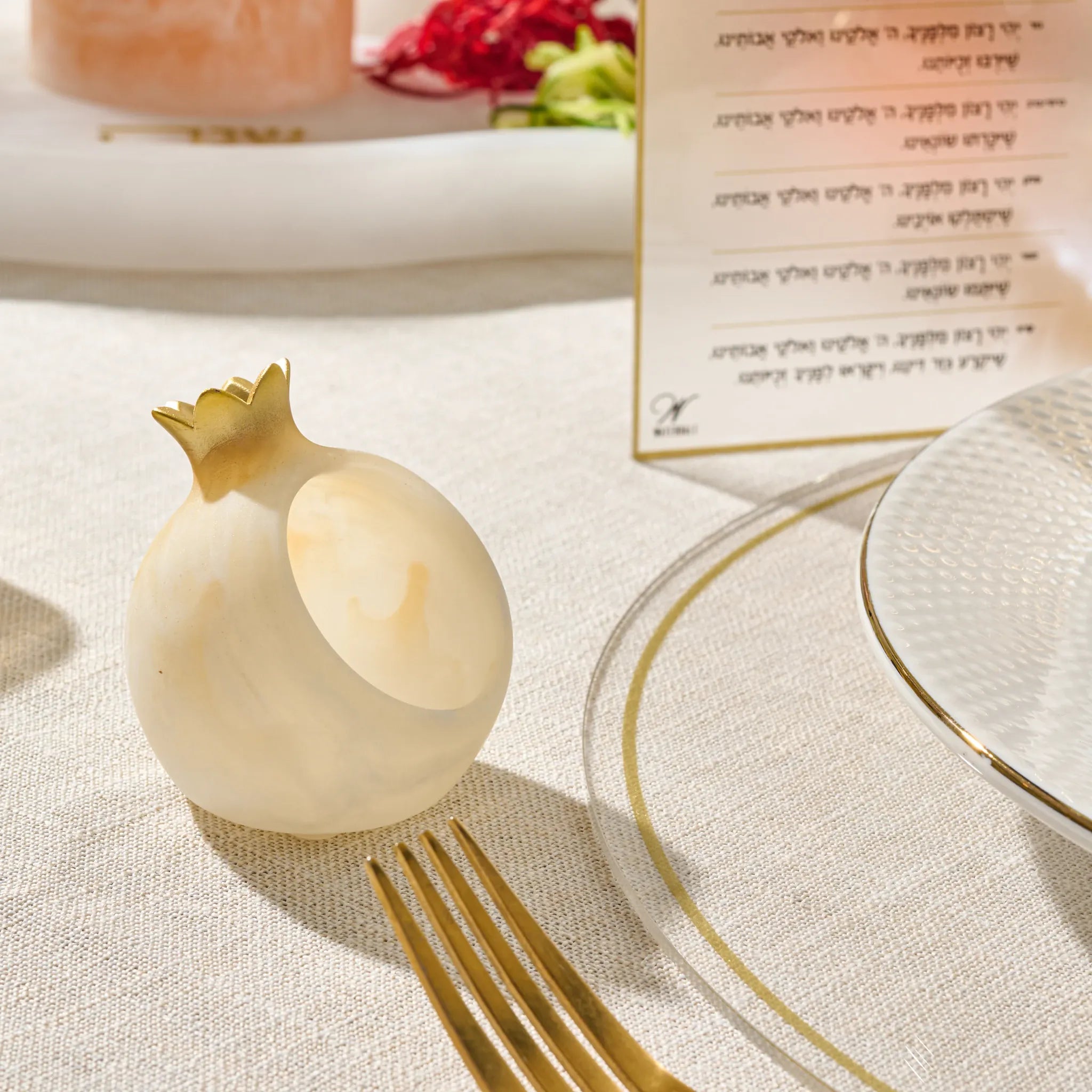 Gold personal pomegranate honey dishes in resin, one per guest for Yom Tov