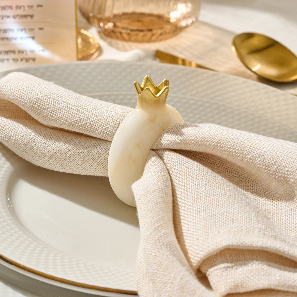 Gold resin pomegranate napkin ring for a Rosh Hashanah place setting