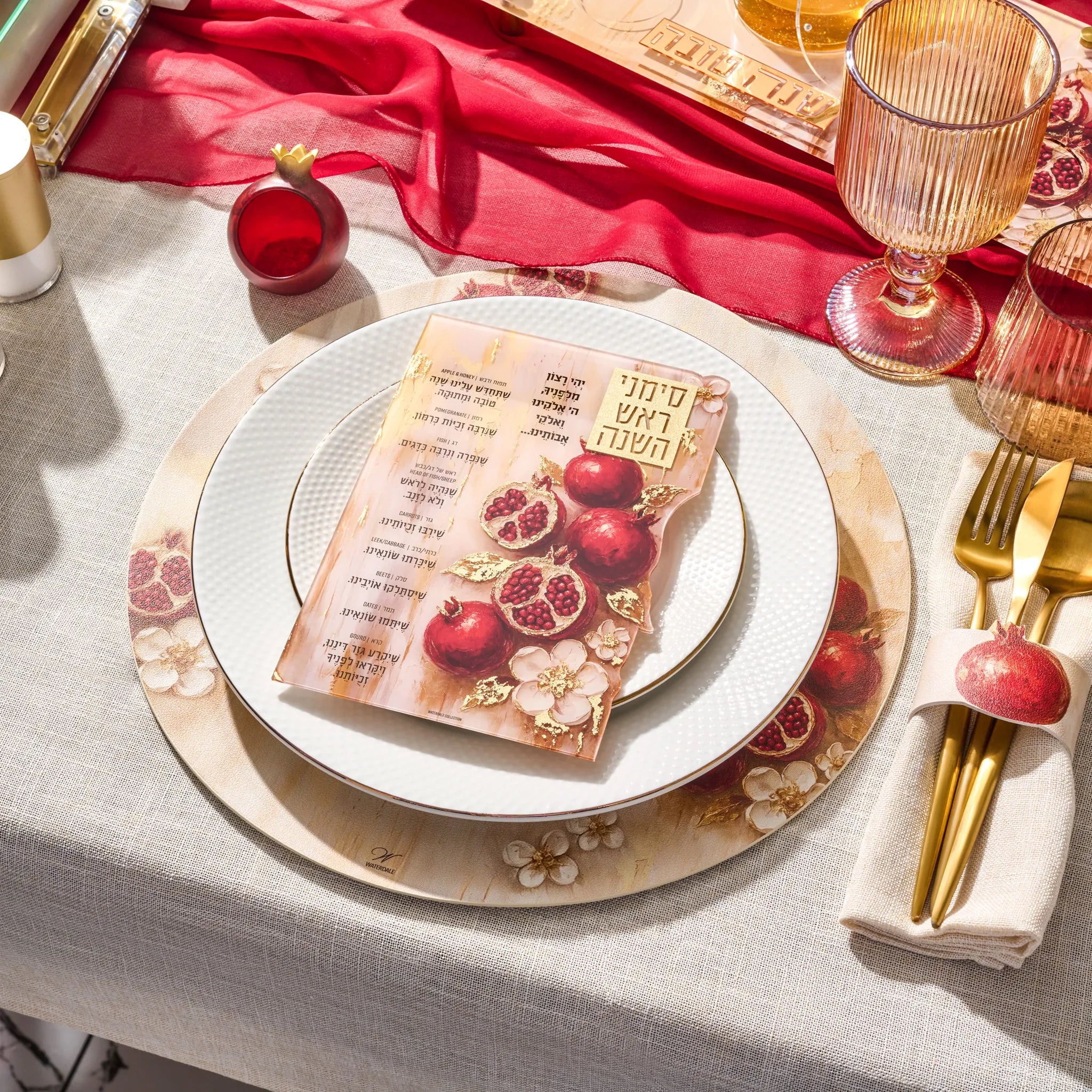Leatherette napkin wraps painted with pomegranates for a Jewish New Year table