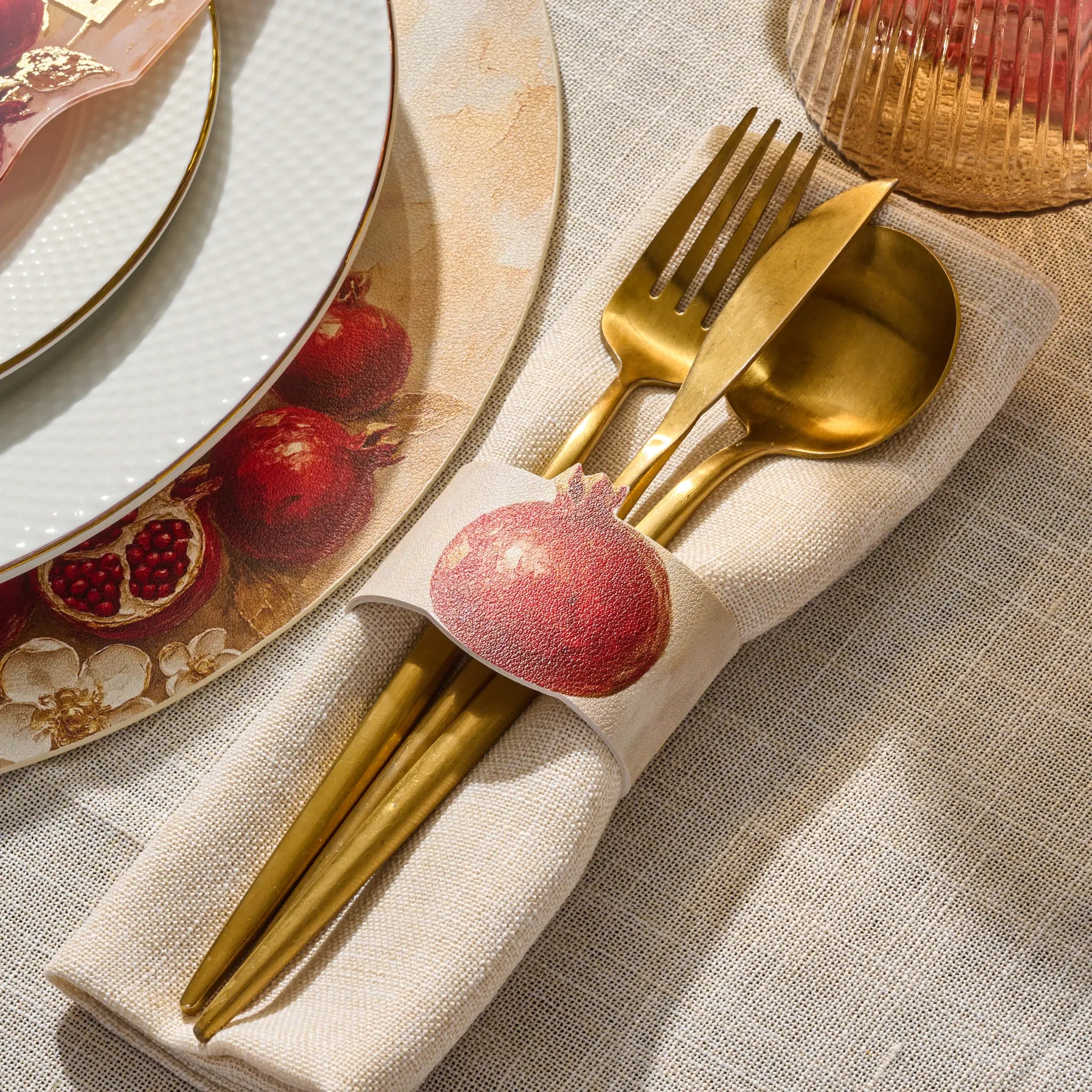 Painted pomegranate napkin wrap with a snap closure for Rosh Hashana