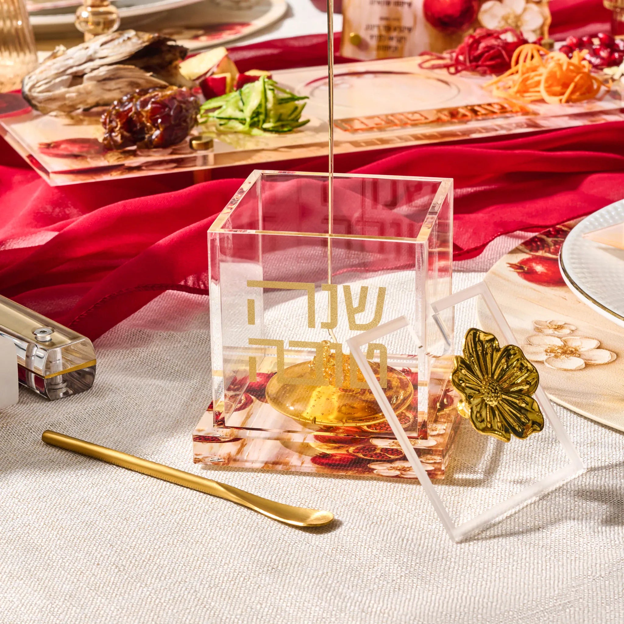 Clear Lucite honey jar engraved Shana Tova with a gold flower handle