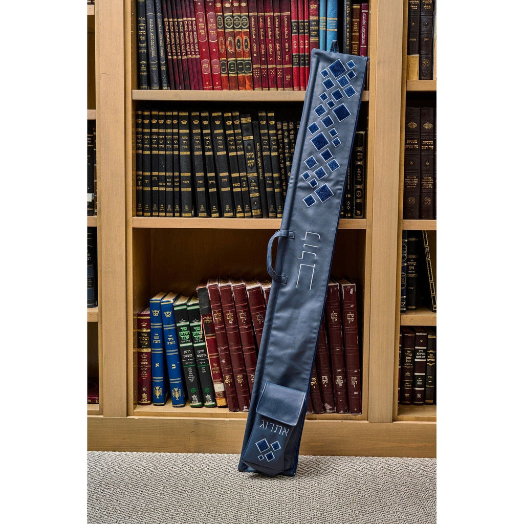 Scattered Fur Lulav and Esrog Case leaning against a wooden bookcase filled with Jewish sefarim.