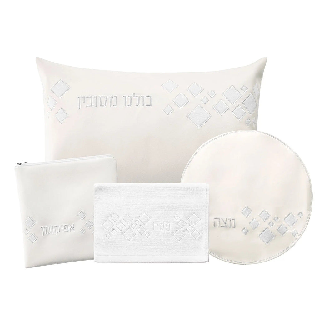 Scattered Fur Pesach Set in white and gold leather by Waterdale Collection, featuring matching placemats, napkins, and circular plate holder for holiday tabletop.