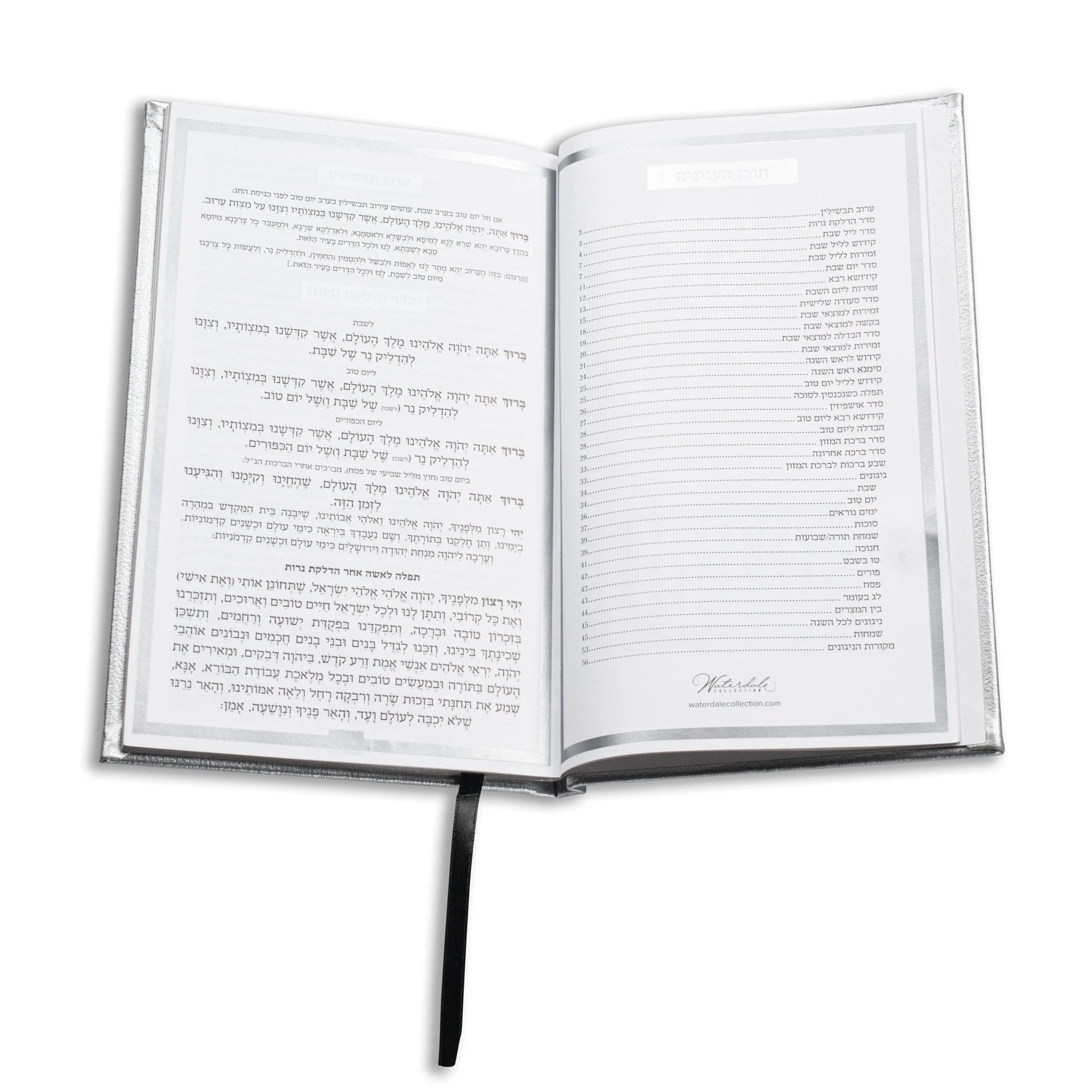 Open Shabbos bencher set showing Hebrew prayer text pages with black binding and bookmark ribbon against white background.