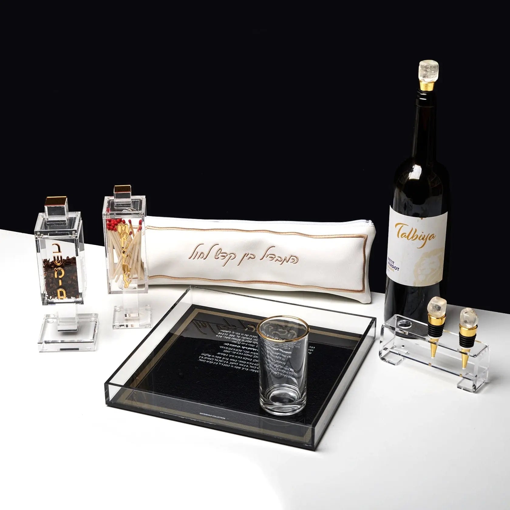 Square black match holder by Waterdale Collection displayed with matches and Shabbat candles on white surface