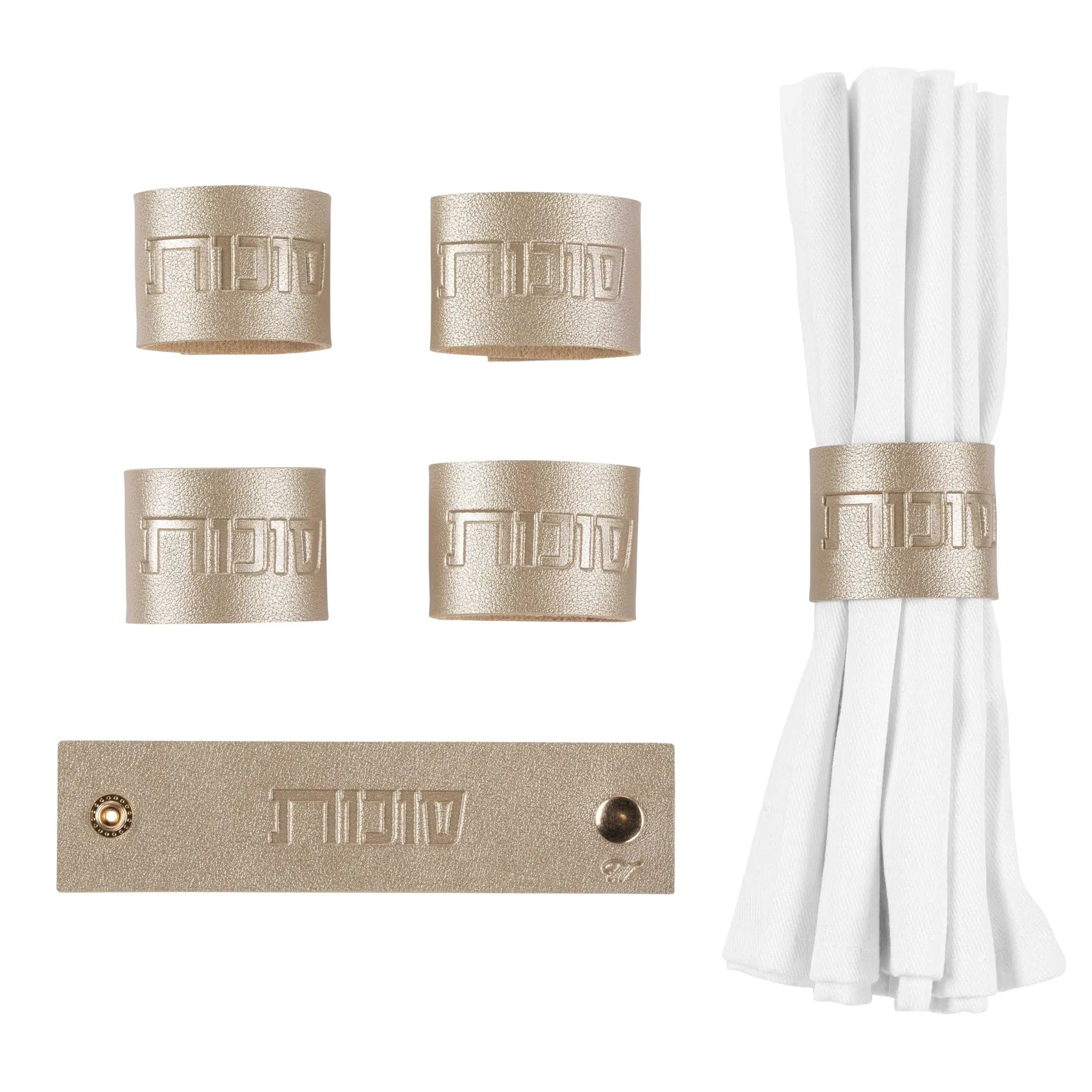 Sukkos leather napkin wraps in gold and silver leatherette with white cloth napkin ties, displayed flat.