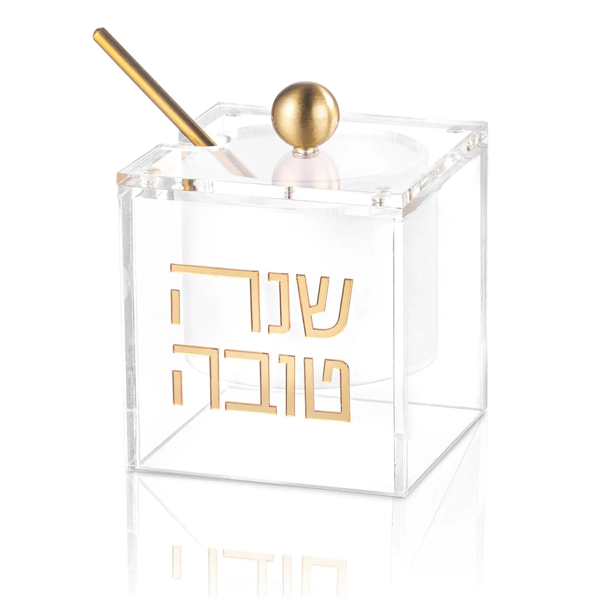 Clear acrylic suspended honey dish with gold Hebrew text and matching gold honey dipper and sphere finial by Waterdale Collection.