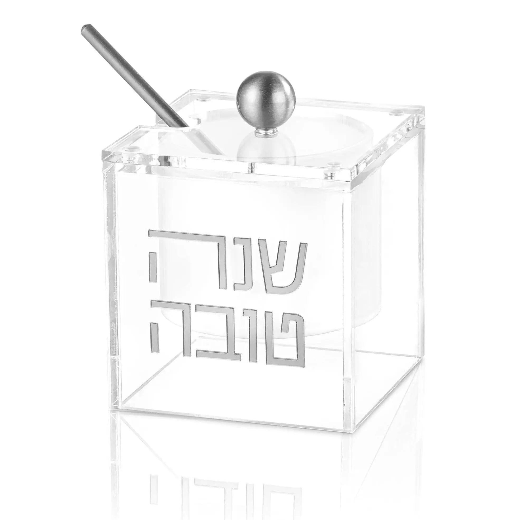 Clear acrylic suspended honey dish with silver spoon and ball finial by Waterdale Collection, modern Judaica tabletop design.