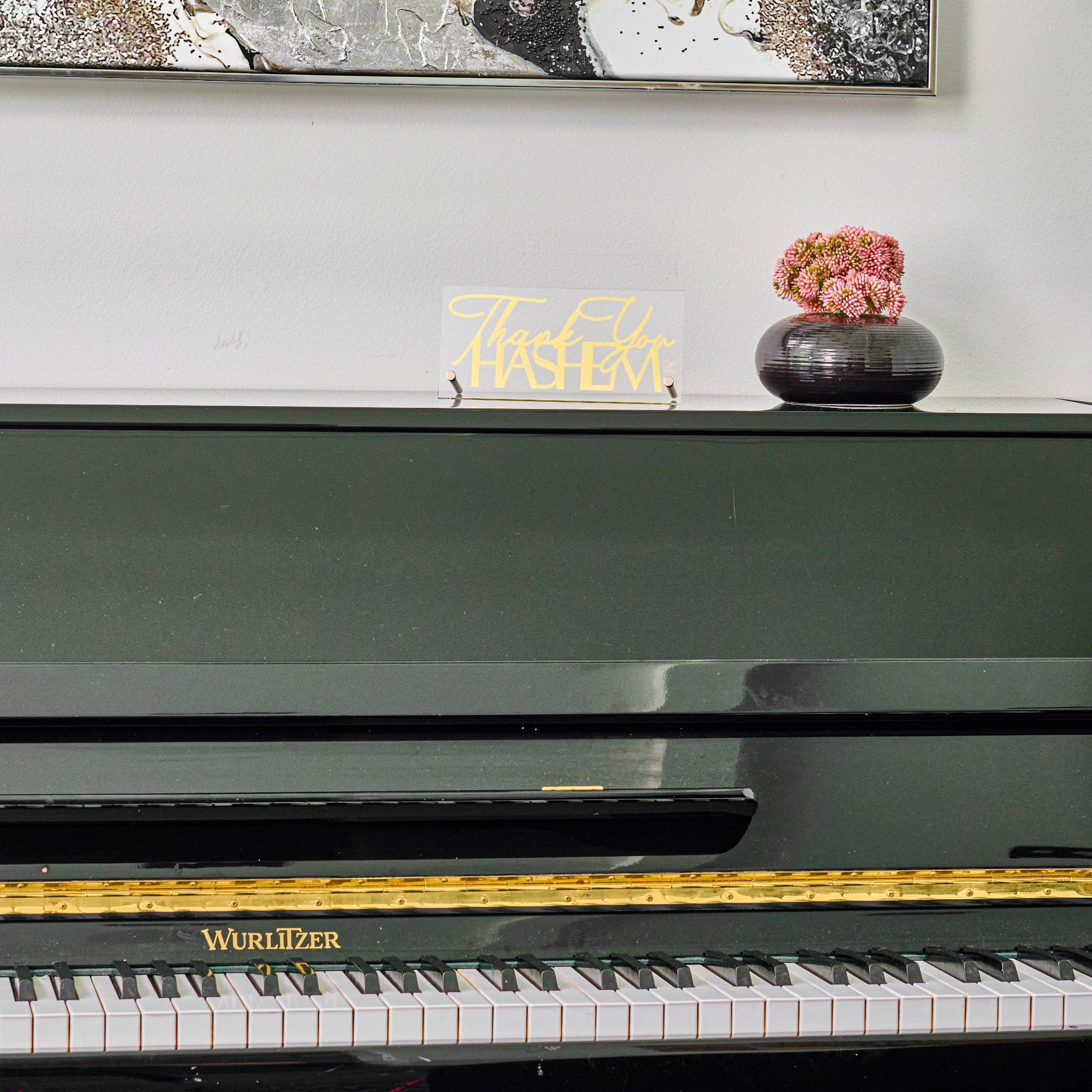 Thank You Hashem Basic Tabletop on a black Wurlitzer piano.