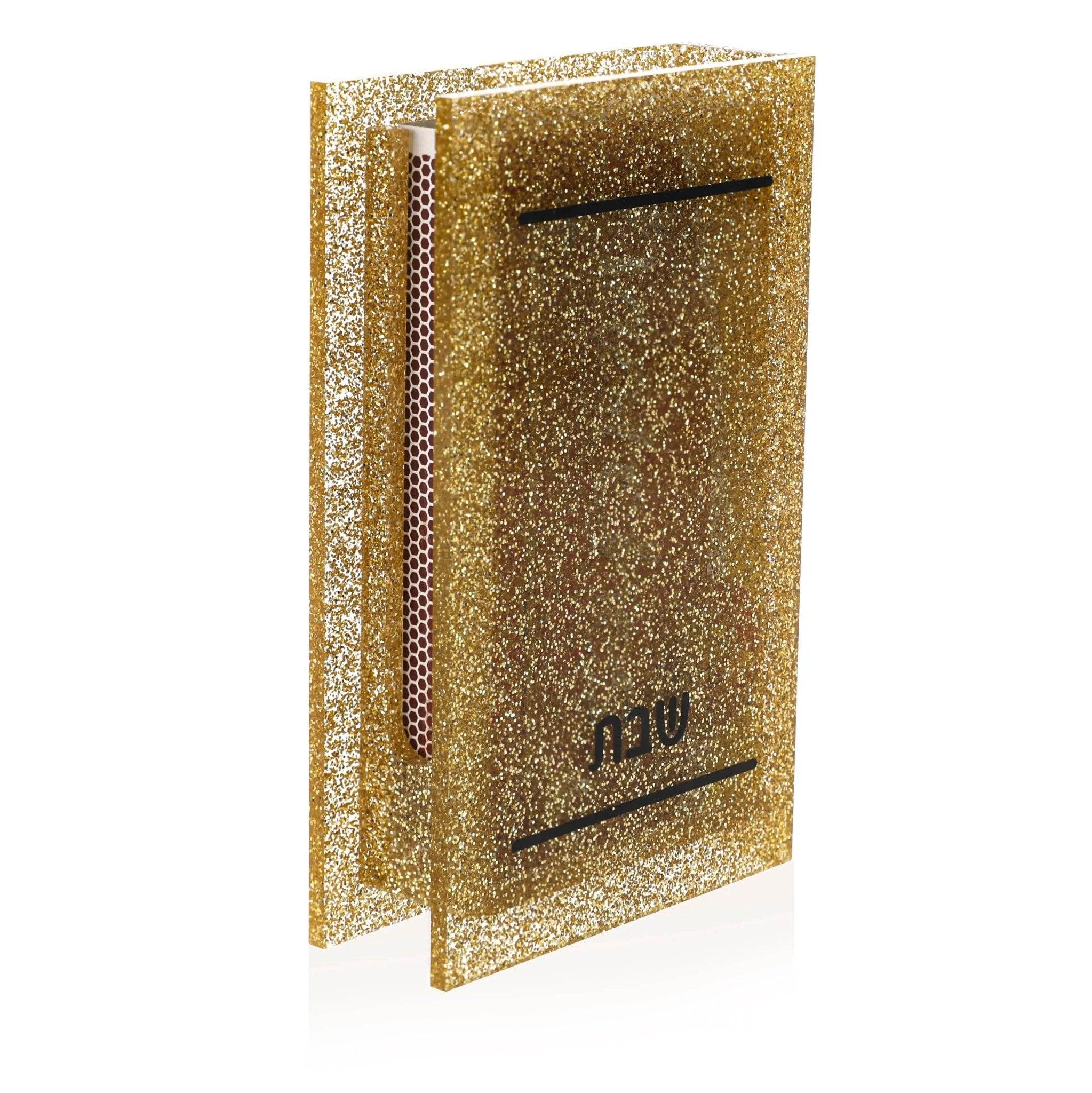 Gold glitter matchbox holder with black slot, perfect for storing matches and candle-lighting supplies during Shabbat.