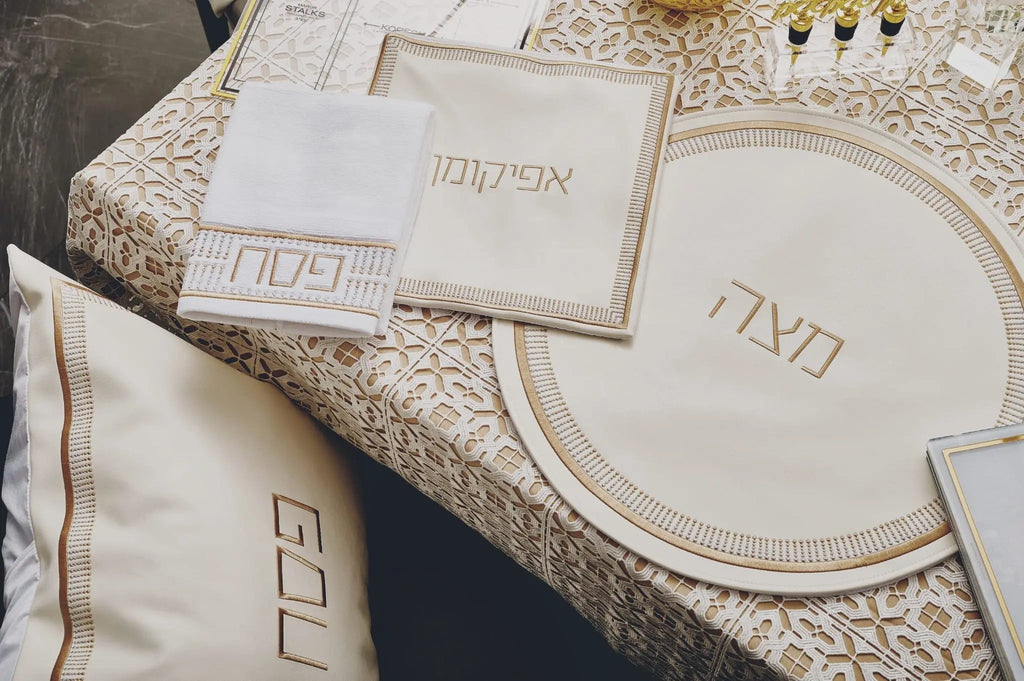 Waterdale Collection Trinket Pesach Set with white and gold leather components displayed on lace table setting, including round plate and matching accessories.