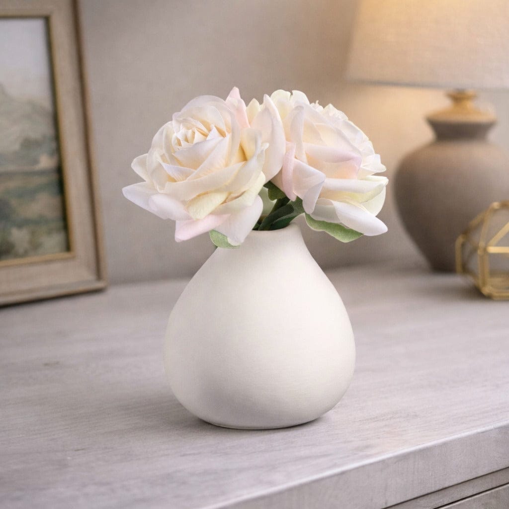 Faux Floral White vase with pink flowers on a wooden surface - Waterdale Collection